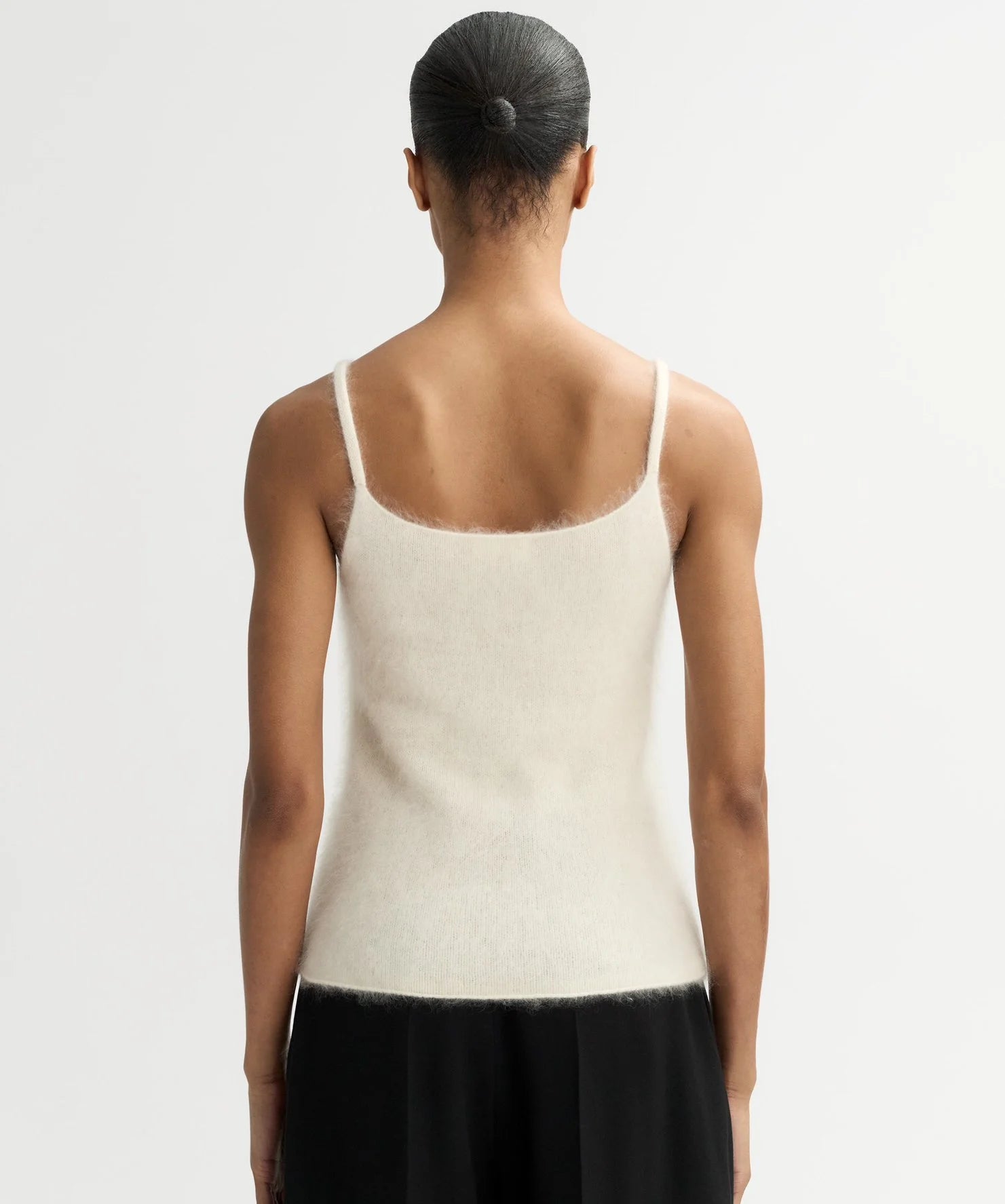 Back of model wearing Soft Goat Brushed Singlet in White