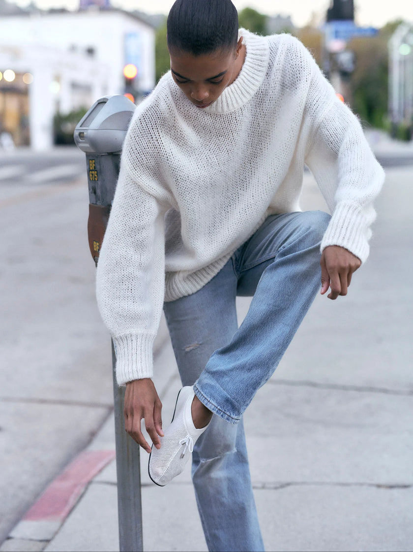 Lifestyle model shot wearing Soft Goat Alpaca Crewneck Sweater in White