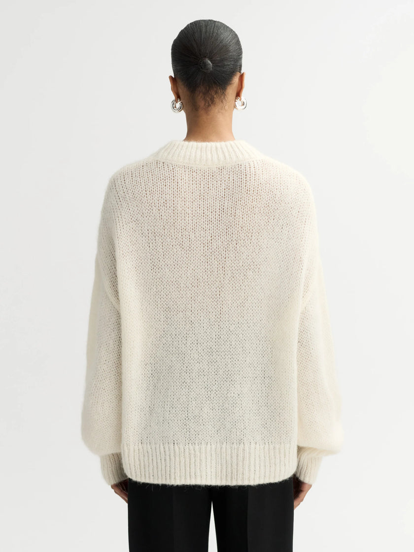 Back of model wearing Soft Goat Alpaca Crewneck Sweater in White