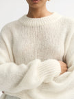 Detail model shot wearing Soft Goat Alpaca Crewneck Sweater in White